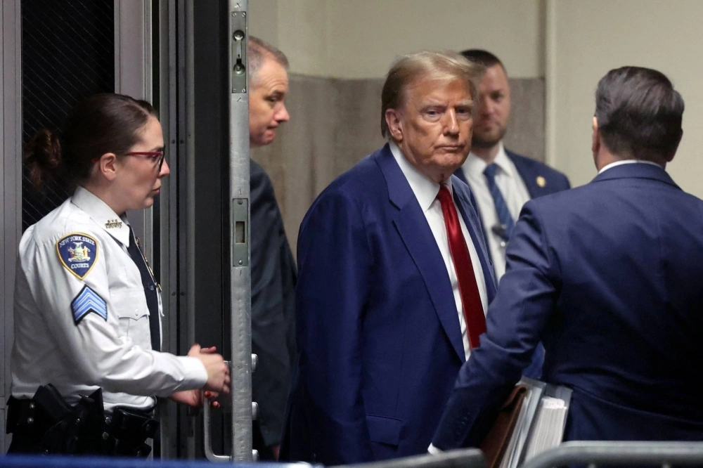 Former U.S. President Donald Trump leaves the court after a pre-trial hearing in a hush money case in New York on March 25. As Trump faces a slew of trials, his opponents should take the comparison to Hitler's court room dramas seriously. Former U.S. President Donald Trump leaves the court after a pre-trial hearing in a hush money case in New York on March 25. As Trump faces a slew of trials, his opponents should take the comparison to Hitler's court room dramas seriously.