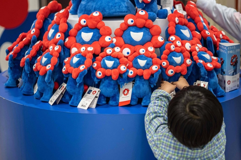 Dolls of Myaku-Myaku, the 2025 Expo's official mascot, at an official store for the event in Osaka on April 2 Dolls of Myaku-Myaku, the 2025 Expo's official mascot, at an official store for the event in Osaka on April 2