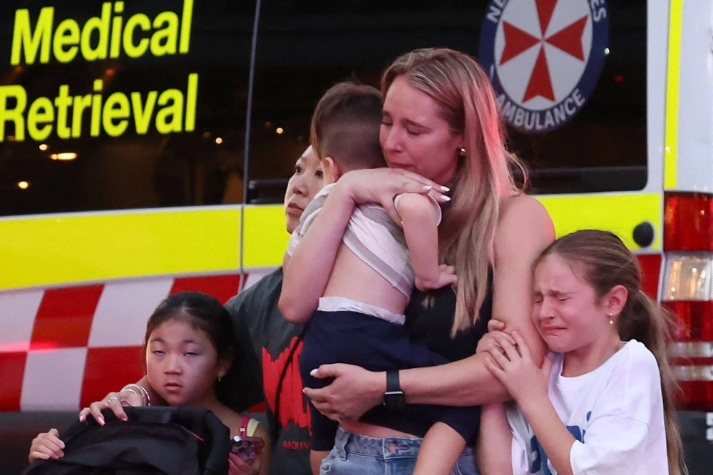 A family leaves the Westfield Bondi Junction shopping mall in Sydney after a stabbing incident on Saturday.  A family leaves the Westfield Bondi Junction shopping mall in Sydney after a stabbing incident on Saturday.
