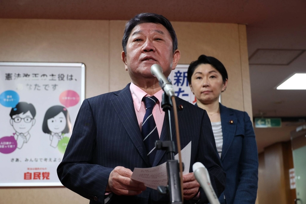 LDP Secretary-General Toshimitsu Motegi and election strategy committee chair Yuko Obuchi speak to reporters in Tokyo on April 2. LDP Secretary-General Toshimitsu Motegi and election strategy committee chair Yuko Obuchi speak to reporters in Tokyo on April 2.