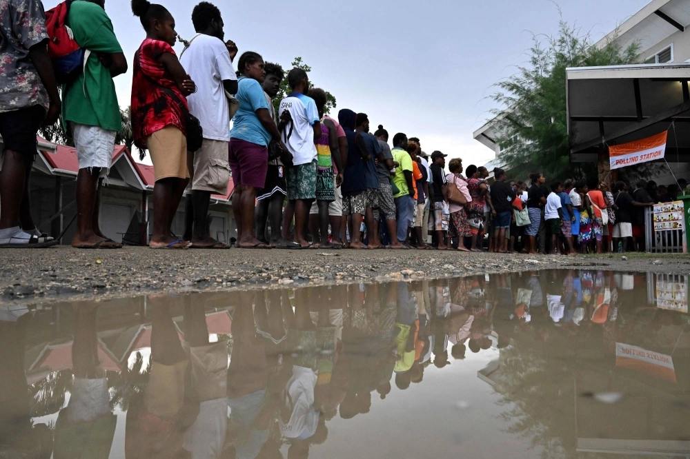 Solomon Islanders queue up to vote outside a polling station in Honiara on Wednesday. The election could reshape regional security, with citizens effectively choosing if their Pacific nation will deepen ties with China.  Solomon Islanders queue up to vote outside a polling station in Honiara on Wednesday. The election could reshape regional security, with citizens effectively choosing if their Pacific nation will deepen ties with China.