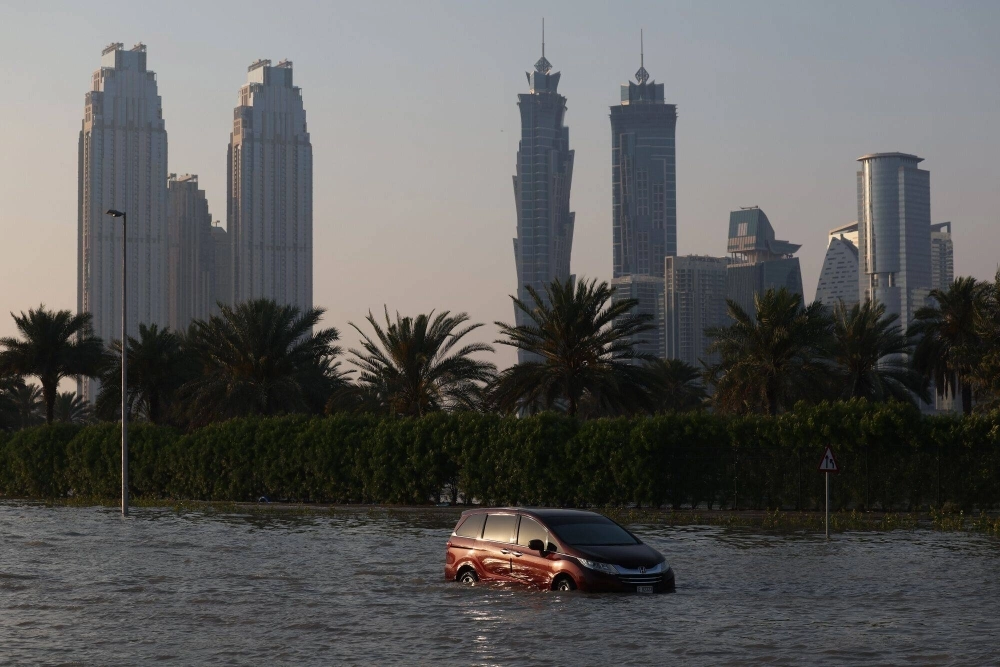 An abandoned vehicle on a flooded highway after a rainstorm in Dubai, United Arab Emirates, on Wednesday. The UAE had its largest rainfall event in 75 years on Tuesday, the government said on social media.  An abandoned vehicle on a flooded highway after a rainstorm in Dubai, United Arab Emirates, on Wednesday. The UAE had its largest rainfall event in 75 years on Tuesday, the government said on social media.