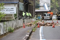 A national road is blocked by fallen rocks on Thursday following a magnitude 6.6 earthquake in Ozu, Ehime Prefecture, the previous day. | Jiji