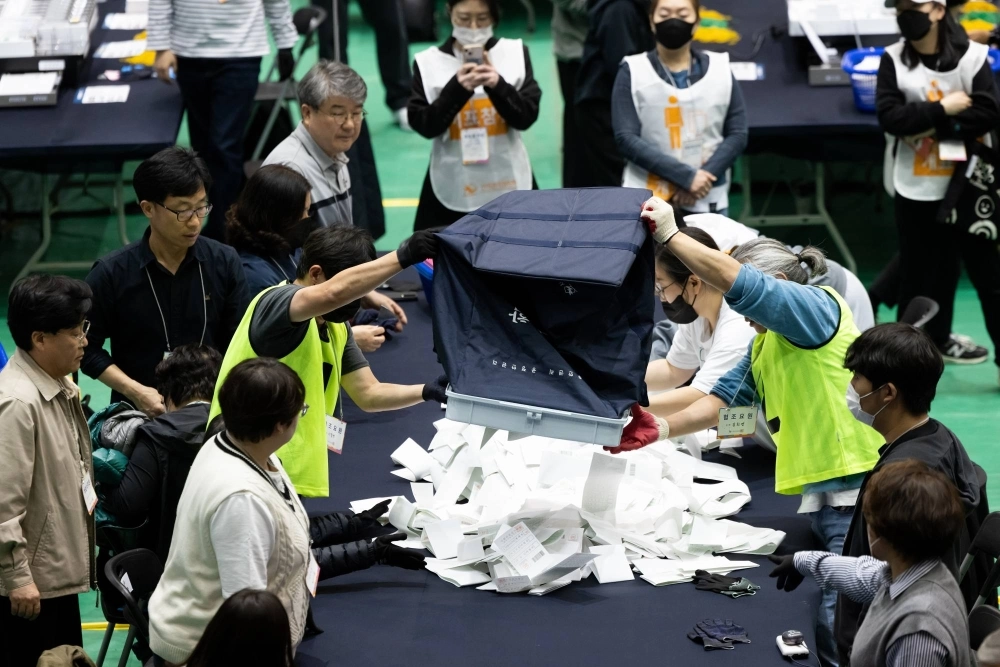 South Korean officials count ballots following a parliamentary election on April 10. President Yoon Suk-yeol’s conservative bloc is set for a major setback in a vote for a new parliament, exit polls showed, likely meaning he will be in a weak position for the remaining three years of his term and face political gridlock. South Korean officials count ballots following a parliamentary election on April 10. President Yoon Suk-yeol’s conservative bloc is set for a major setback in a vote for a new parliament, exit polls showed, likely meaning he will be in a weak position for the remaining three years of his term and face political gridlock.