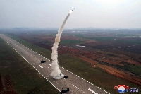 North Korea conducts a test launch of a "Pyoljji-1-2" new-type anti-aircraft missile in this photo released Saturday.   | KCNA / KNS / VIA AFP-JIJI