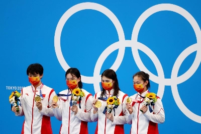China's Olympic gold-medal winning 4 x 200 meter freestyle relay team celebrates on the podium at the Tokyo Aquatics Centre on July 29, 2021.  Zhang Yufei (third from left) is among 23 top Chinese swimmers who tested positive for a banned substance in the lead up to the Games.   China's Olympic gold-medal winning 4 x 200 meter freestyle relay team celebrates on the podium at the Tokyo Aquatics Centre on July 29, 2021.  Zhang Yufei (third from left) is among 23 top Chinese swimmers who tested positive for a banned substance in the lead up to the Games.