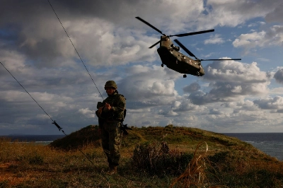 The Ground Self-Defense Force's Amphibious Rapid Deployment Brigade takes part in a military drill on the uninhabited Irisuna island in Okinawa Prefecture, close to the prefecture's main island, in November. Japan's defense-related spending for fiscal 2024 is expanding to 1.6% of its gross domestic product. The Ground Self-Defense Force's Amphibious Rapid Deployment Brigade takes part in a military drill on the uninhabited Irisuna island in Okinawa Prefecture, close to the prefecture's main island, in November. Japan's defense-related spending for fiscal 2024 is expanding to 1.6% of its gross domestic product.
