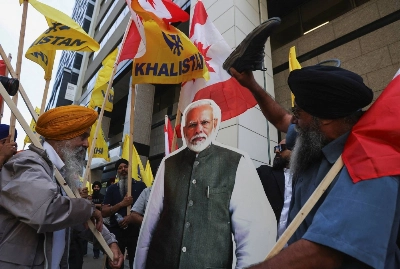 Demonstrators surround a cardboard cutout of Indian Prime Minister Narendra Modi during a protest outside the Indian Consulate in Toronto after Canadian Prime Minister Justin Trudeau raised the prospect of New Delhi's involvement in the murder of Sikh separatist leader in the country last September. Demonstrators surround a cardboard cutout of Indian Prime Minister Narendra Modi during a protest outside the Indian Consulate in Toronto after Canadian Prime Minister Justin Trudeau raised the prospect of New Delhi's involvement in the murder of Sikh separatist leader in the country last September.