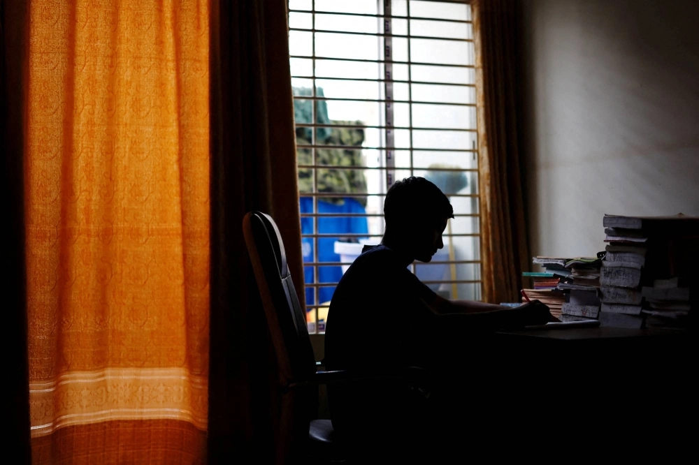 Sheikh Tamim Hasan, 13, studies in his room as authorities decided to close schools during a countrywide heat wave in Dhaka on Tuesday. Sheikh Tamim Hasan, 13, studies in his room as authorities decided to close schools during a countrywide heat wave in Dhaka on Tuesday.