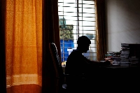 Sheikh Tamim Hasan, 13, studies in his room as authorities decided to close schools during a countrywide heat wave in Dhaka on Tuesday. | REUTERS