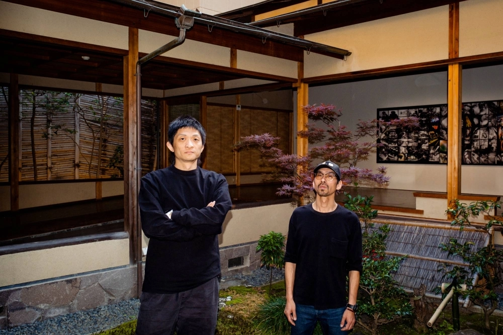 Birdhead members Ji Weiyu (left) and Song Tao, who are exhibiting “The Matrix” facing the “chikuin no ma” garden at Kondaya Genbei as part of Kyotographie 2024. Birdhead members Ji Weiyu (left) and Song Tao, who are exhibiting “The Matrix” facing the “chikuin no ma” garden at Kondaya Genbei as part of Kyotographie 2024.