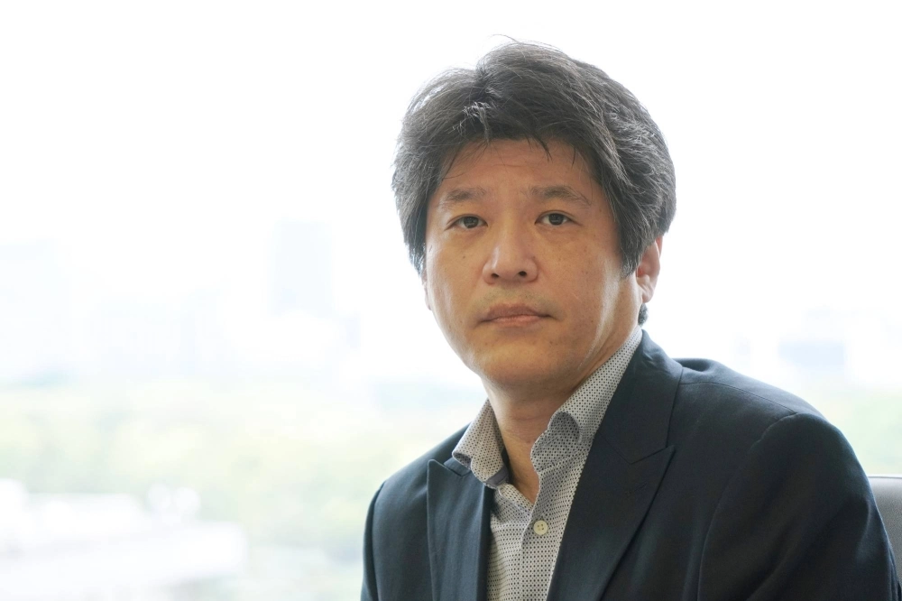 Tatsufumi Shibata, deputy director-general at the Financial Services Agency, is pushing for greater disclosure by companies of their cross-shareholding practices. Tatsufumi Shibata, deputy director-general at the Financial Services Agency, is pushing for greater disclosure by companies of their cross-shareholding practices.
