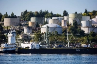 A double-hulled tanker sits docked in front of the Burnaby Refinery, near Vancouver. Natural gas is a key component of the city’s energy use. | Bloomberg