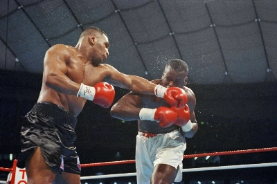 Mike Tyson (left) and Buster Douglas fight during the seventh round of their world heavyweight title fight at Tokyo Dome on Feb. 11, 1990. Mike Tyson (left) and Buster Douglas fight during the seventh round of their world heavyweight title fight at Tokyo Dome on Feb. 11, 1990.