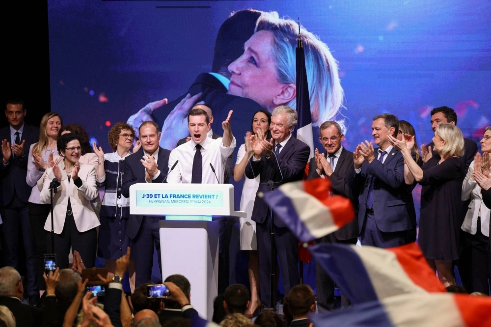 Jordan Bardella, President of the French far-right National Rally party, gestures he attends a political rally during the party's campaign for the European elections in Perpignan, France, on May 1. Jordan Bardella, President of the French far-right National Rally party, gestures he attends a political rally during the party's campaign for the European elections in Perpignan, France, on May 1.