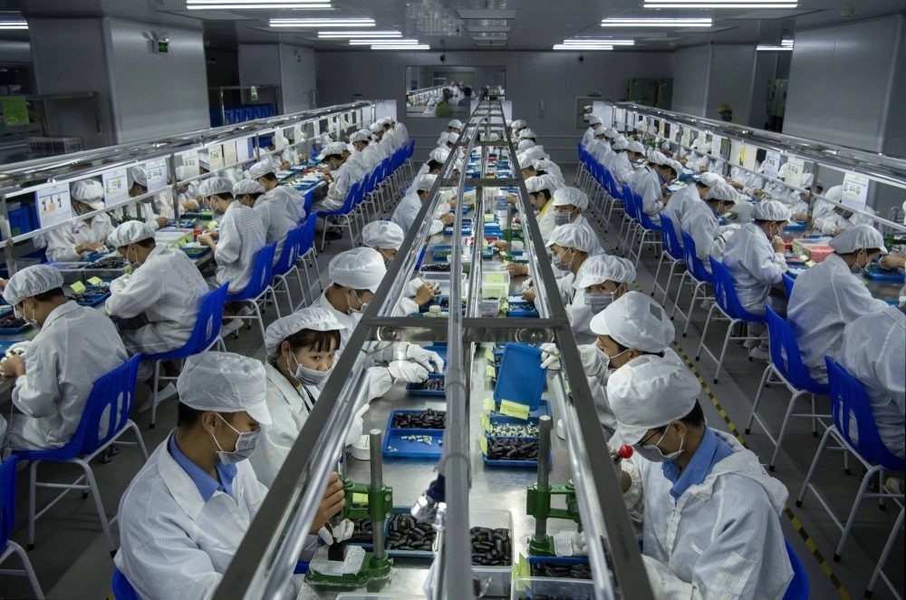 Workers make pods for e-cigarettes on the production line at Kanger Tech, one of China's leading manufacturers of vaping products, on Sept. 24, 2019 in Shenzhen, China. Workers make pods for e-cigarettes on the production line at Kanger Tech, one of China's leading manufacturers of vaping products, on Sept. 24, 2019 in Shenzhen, China.