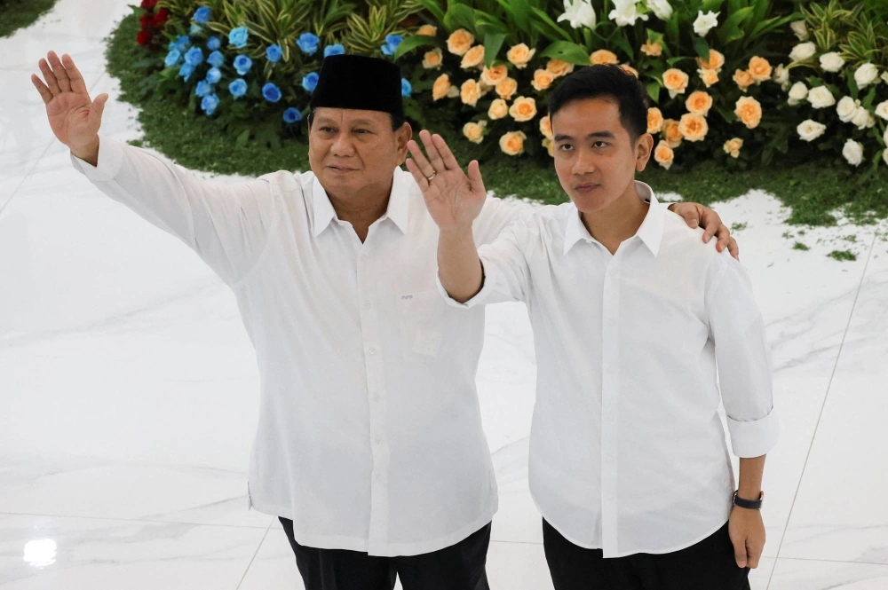 Indonesia's new president Prabowo Subianto and vice president Gibran Rakabuming Raka wave after the country's election commission officially announced them as the presidential election winners at General Election Commission (KPU) headquarters in Jakarta, on April 24. Indonesia's new president Prabowo Subianto and vice president Gibran Rakabuming Raka wave after the country's election commission officially announced them as the presidential election winners at General Election Commission (KPU) headquarters in Jakarta, on April 24.