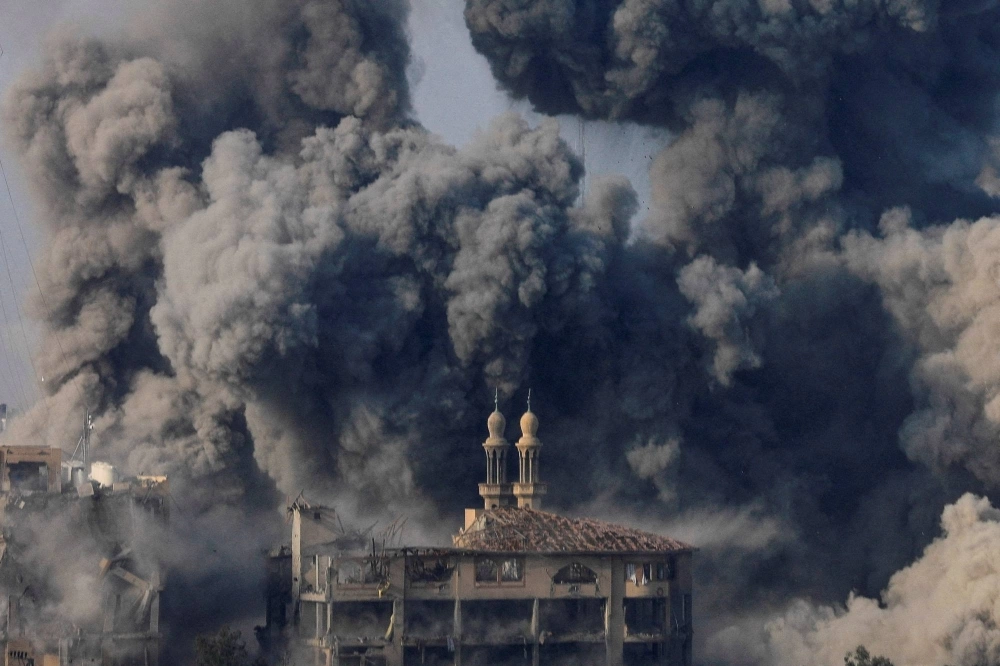 Smoke billows following Israeli strikes on the Islamic University of Gaza (IUG) on October 11, 2023. Smoke billows following Israeli strikes on the Islamic University of Gaza (IUG) on October 11, 2023.