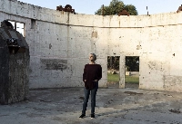 Penny Sackett, a former director of the Australian National University’s Mount Stromlo Observatory, in the remains of the observatory, which was destroyed by a wildfire in 2003, just outside Canberra on May 6.  | David Maurice Smith / The New York Times