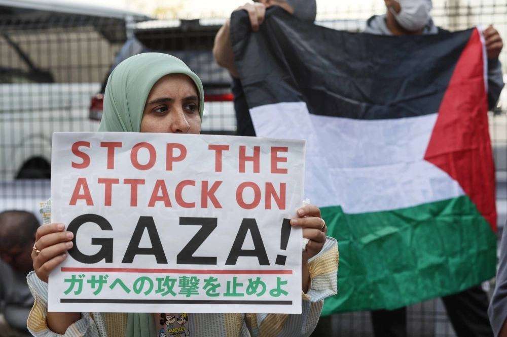 A pro-Palestinian supporter in Tokyo takes part in a protest against Israeli attacks on Gaza. Japanese universities are also experiencing their share of pro-Palestinian student demonstrations similar to those elsewhere in the world. A pro-Palestinian supporter in Tokyo takes part in a protest against Israeli attacks on Gaza. Japanese universities are also experiencing their share of pro-Palestinian student demonstrations similar to those elsewhere in the world.