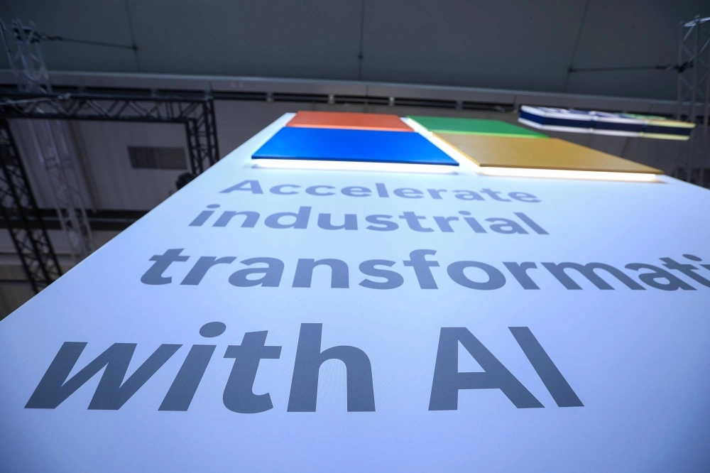 A slogan reads "Accelerate Industrial Transformation With AI" at the Microsoft booth at the Hannover Messe 2024 trade fair in Hannover, Germany, on April 22. A slogan reads "Accelerate Industrial Transformation With AI" at the Microsoft booth at the Hannover Messe 2024 trade fair in Hannover, Germany, on April 22.