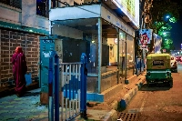 An air-conditioned bus shelter with a broken glass window in Kolkata on April 23 | Bloomberg