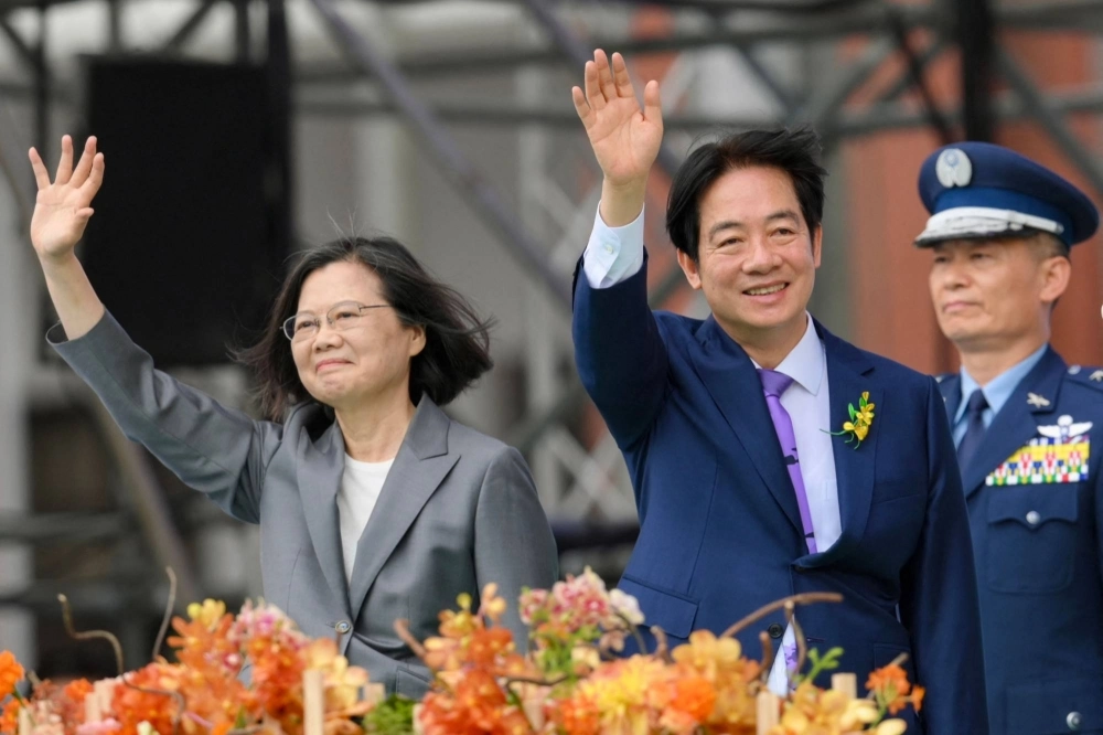 New Taiwanese President Lai Ching-te (right) waves alongside outgoing leader Tsai Ing-wen during the presidential inauguration ceremony at the Presidential Office in Taipei on Monday. New Taiwanese President Lai Ching-te (right) waves alongside outgoing leader Tsai Ing-wen during the presidential inauguration ceremony at the Presidential Office in Taipei on Monday.