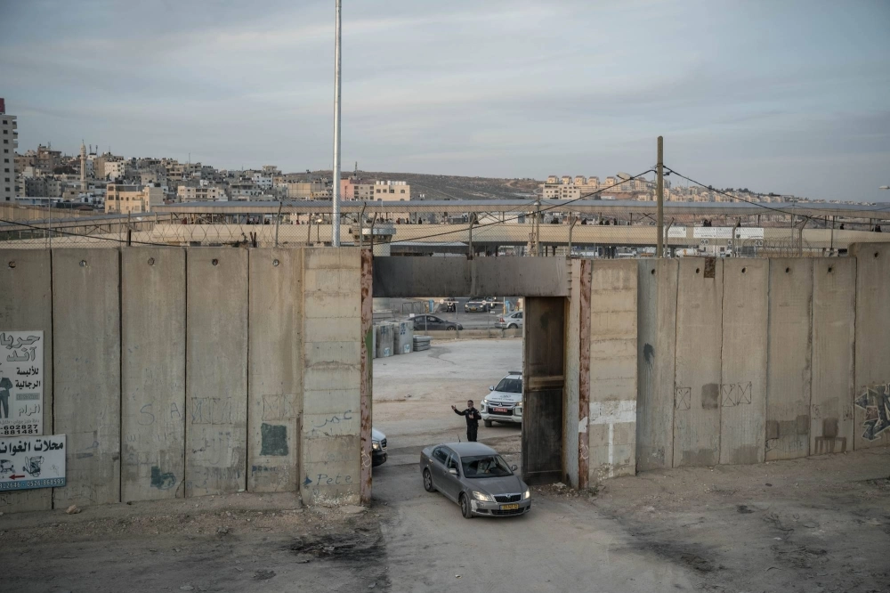 An Israeli officer directing traffic at the Qalandia checkpoint between Ramallah, in the Israeli-occupied West Bank, and Jerusalem on Dec. 3, 2023. Spain, Norway and Ireland said on Wednesday that they would recognize an independent Palestinian state, a rebuke to Israel over its war in Gaza and its decades of occupation of Palestinian territories. An Israeli officer directing traffic at the Qalandia checkpoint between Ramallah, in the Israeli-occupied West Bank, and Jerusalem on Dec. 3, 2023. Spain, Norway and Ireland said on Wednesday that they would recognize an independent Palestinian state, a rebuke to Israel over its war in Gaza and its decades of occupation of Palestinian territories.