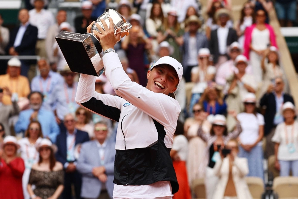 Iga Swiatek celebrates after winning the French Open title on June 10, 2023. Iga Swiatek celebrates after winning the French Open title on June 10, 2023.