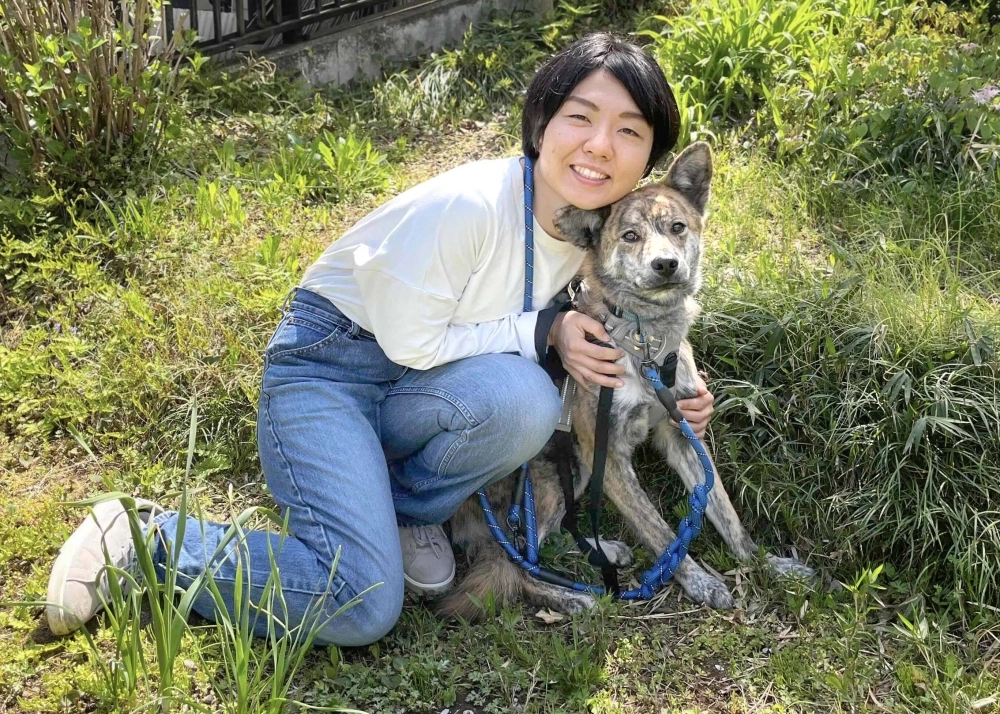 Yumi Oshida and Truffle enjoy walks together through their neighborhood whenever they can. 
 Yumi Oshida and Truffle enjoy walks together through their neighborhood whenever they can.