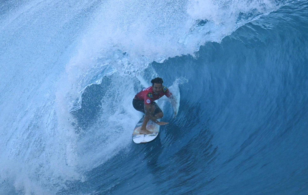 Brazilian surfer Italo Ferreira competes during the men's final at the  Shiseido Tahiti Pro surfing competition in Teahupo'o, Tahiti, on Thursday.
 Brazilian surfer Italo Ferreira competes during the men's final at the  Shiseido Tahiti Pro surfing competition in Teahupo'o, Tahiti, on Thursday.