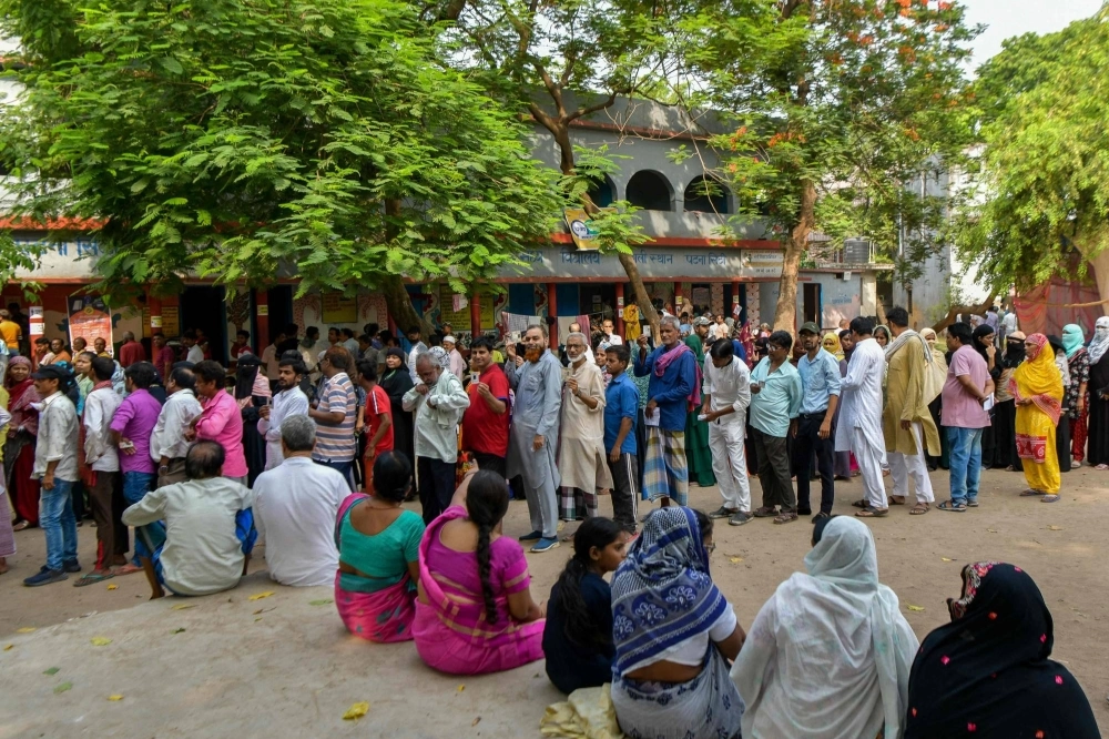 Voters stand in line to cast their ballot at a polling station on the seventh and final phase of voting of India's general election, in Patna on Saturday. Voters stand in line to cast their ballot at a polling station on the seventh and final phase of voting of India's general election, in Patna on Saturday.