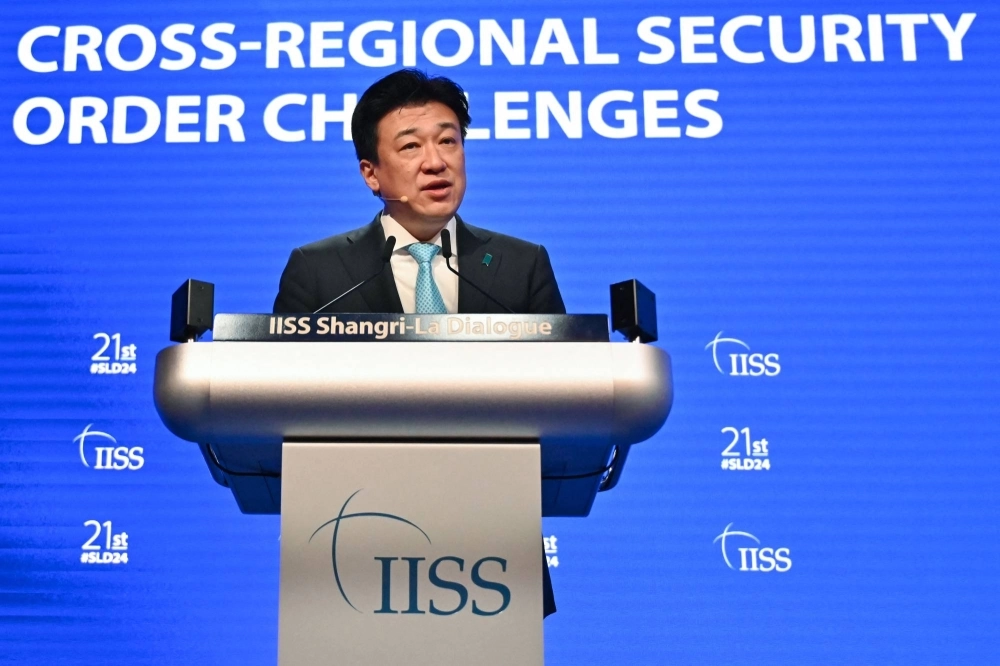 Defense Minister Minoru Kihara delivers a speech during the Shangri-La Dialogue regional security conference in Singapore on Saturday. Defense Minister Minoru Kihara delivers a speech during the Shangri-La Dialogue regional security conference in Singapore on Saturday.