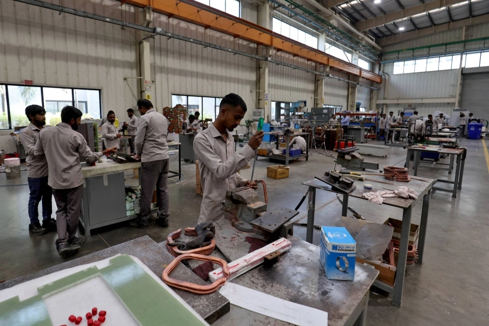 Employees assemble an electric transformer on the outskirts of Ahmedabad, India, on March 28. Employees assemble an electric transformer on the outskirts of Ahmedabad, India, on March 28.