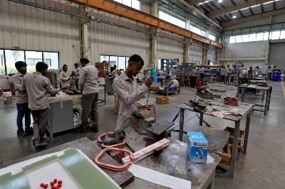 Employees assemble an electric transformer on the outskirts of Ahmedabad, India, on March 28. Employees assemble an electric transformer on the outskirts of Ahmedabad, India, on March 28.