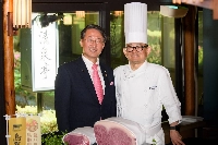 Tottori Gov. Shinji Hirai (left) with Shinsuke Nakajima, executive chef at the Hotel New Otani Tokyo | YUICO TAIYA