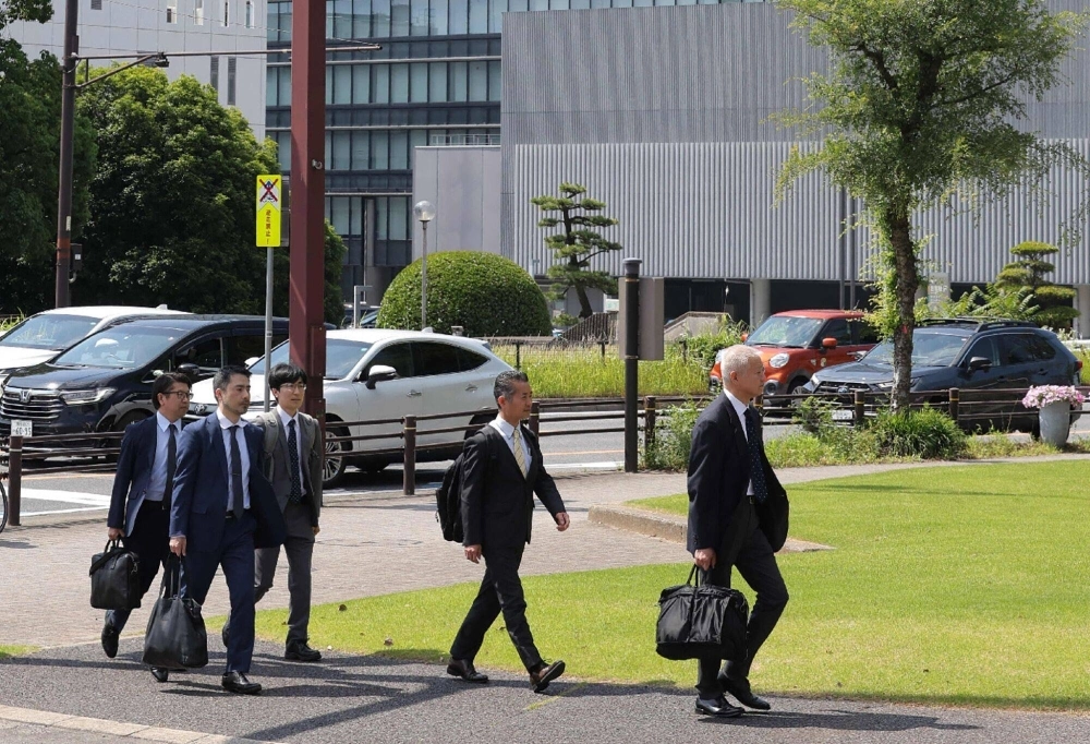 Officials from the transport ministry arrive for an inspection at Toyota headquarters in the city of Toyota, Aichi Prefecture, on Tuesday. Officials from the transport ministry arrive for an inspection at Toyota headquarters in the city of Toyota, Aichi Prefecture, on Tuesday.