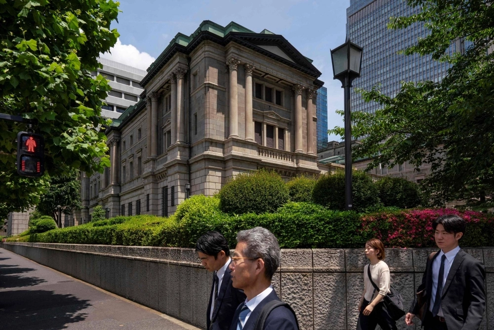 The Bank of Japan's headquarters in Tokyo. Some investors are expecting the central bank to cut bond purchases this month and then raise rates in July. The Bank of Japan's headquarters in Tokyo. Some investors are expecting the central bank to cut bond purchases this month and then raise rates in July.