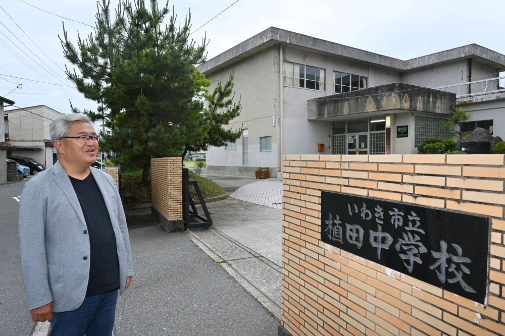 Takayuki Midorikawa stands in front of Ueda Junior High School in Iwaki, Fukushima Prefecture. Takayuki Midorikawa stands in front of Ueda Junior High School in Iwaki, Fukushima Prefecture.