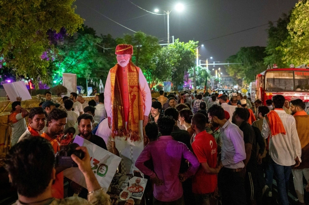 Supporters of the Bhartiya Janata Party (BJP) celebrate outside the headquarters during election results night in New Delhi on Tuesday. More than 20 opposition parties, spearheaded by Rahul Gandhi, formed a united front in a bid to stop Prime Minister Narendra Modi's once-dominant electoral machine. Supporters of the Bhartiya Janata Party (BJP) celebrate outside the headquarters during election results night in New Delhi on Tuesday. More than 20 opposition parties, spearheaded by Rahul Gandhi, formed a united front in a bid to stop Prime Minister Narendra Modi's once-dominant electoral machine.