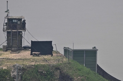 A South Korean soldier stands guard near a military facility where loudspeakers dismantled in 2018 used to be, near the Demilitarized Zone separating the two Koreas in Paju, South Korea, on Tuesday. A South Korean soldier stands guard near a military facility where loudspeakers dismantled in 2018 used to be, near the Demilitarized Zone separating the two Koreas in Paju, South Korea, on Tuesday.