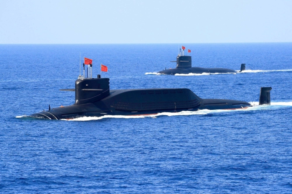 A nuclear-powered Type 094A Jin-class ballistic missile submarine of the Chinese People's Liberation Army Navy is seen during a military display in the South China Sea on April 12, 2018. The submarine that surfaced in the Taiwan Strait on Tuesday appeared to be one of this class. A nuclear-powered Type 094A Jin-class ballistic missile submarine of the Chinese People's Liberation Army Navy is seen during a military display in the South China Sea on April 12, 2018. The submarine that surfaced in the Taiwan Strait on Tuesday appeared to be one of this class.