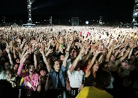 Fans cheer as the Rolling Stones perform during their concert at Magnetic Hill Park in Moncton, New Brunswick, Canada, on Sept. 3, 2005.  | REUTERS