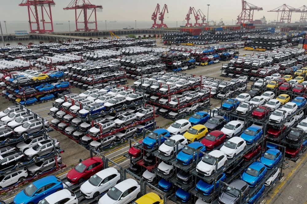 Electric cars are stacked for export at the international container terminal of Taicang Port in Suzhou, China. Electric cars are stacked for export at the international container terminal of Taicang Port in Suzhou, China.