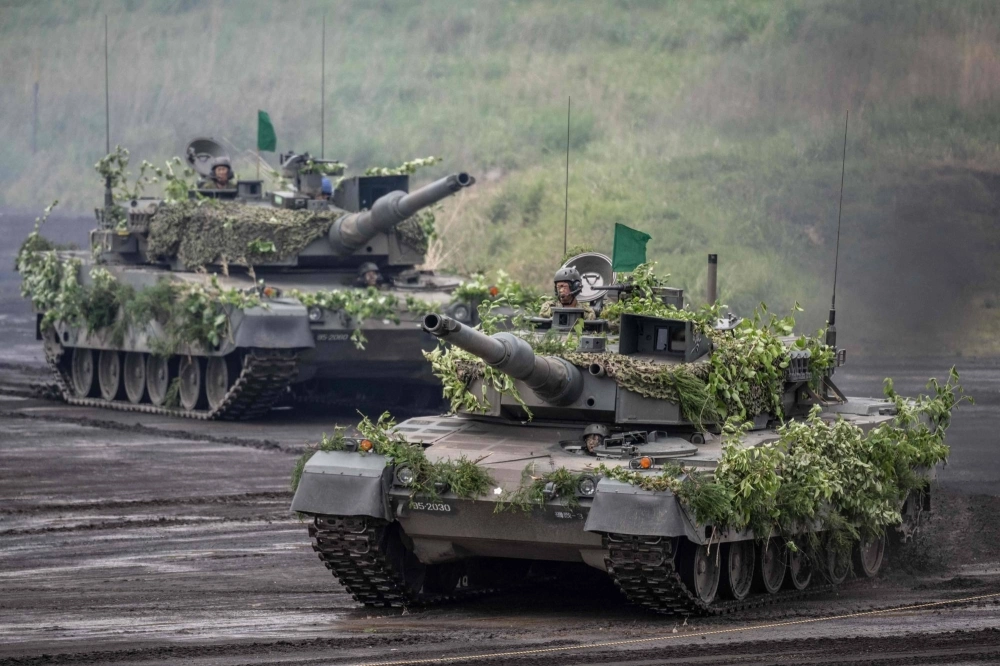 Japan Ground Self-Defense Force tanks take part in a live fire exercise near Gotemba on May 26. Japan Ground Self-Defense Force tanks take part in a live fire exercise near Gotemba on May 26.