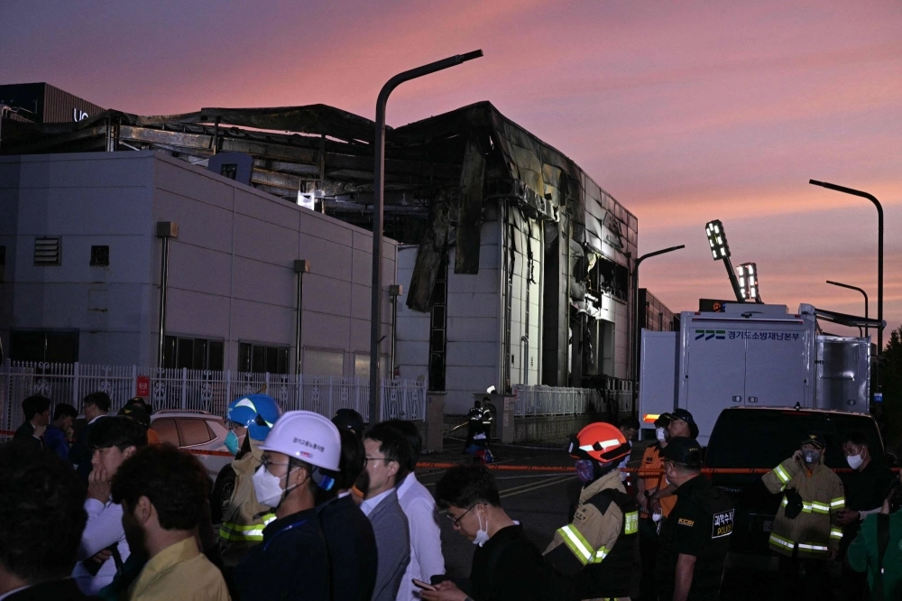 The fire-damaged lithium battery factory owned by South Korean battery maker Aricell is seen at dusk in Hwaseong on Monday. The fire-damaged lithium battery factory owned by South Korean battery maker Aricell is seen at dusk in Hwaseong on Monday.