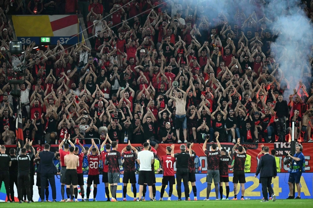 Albania's players greet their fans after a UEFA Euro 2024 Group B soccer match between Albania and Spain in Duesseldorf on Monday. Albania's players greet their fans after a UEFA Euro 2024 Group B soccer match between Albania and Spain in Duesseldorf on Monday.