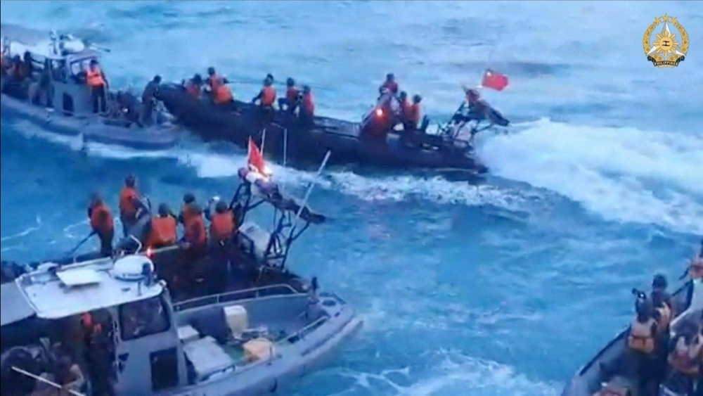 China Coast Guard personnel aboard rigid hull inflatable boats (in black) during a confrontation with Philippine Navy personnel near the Second Thomas Shoal in disputed waters of the South China Sea on June 17 China Coast Guard personnel aboard rigid hull inflatable boats (in black) during a confrontation with Philippine Navy personnel near the Second Thomas Shoal in disputed waters of the South China Sea on June 17