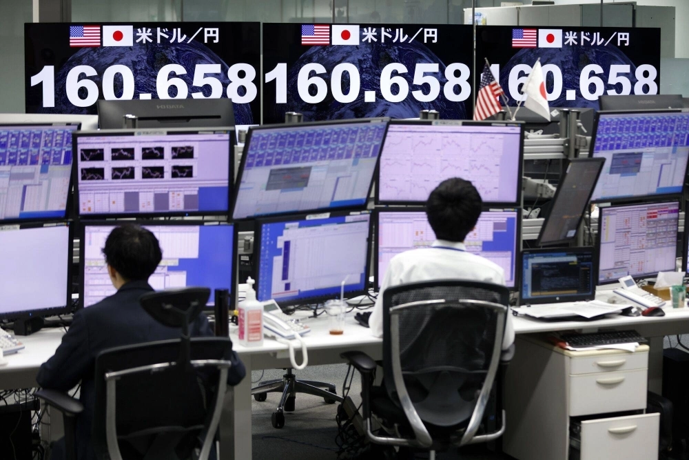 The rate of the yen against the dollar displayed in the trading room at foreign exchange brokerage Gaitame.com in Tokyo on Thursday. The rate of the yen against the dollar displayed in the trading room at foreign exchange brokerage Gaitame.com in Tokyo on Thursday.