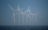 Wind turbines near New Brighton, England. According to the International Energy Agency, Japan could produce over 900% of its energy demand with offshore wind alone. | Reuters